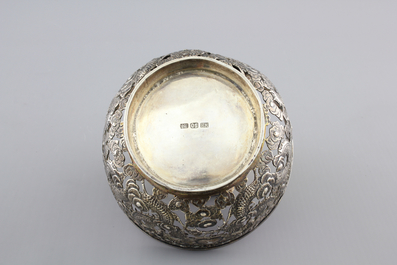 An open-worked Chinese silver dragon bowl, Wang Hing, China, 19th C.