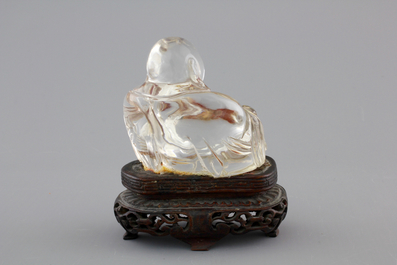 A Chinese rock crystal Buddha on stand, 18/19th C.