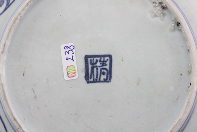 A Chinese blue and white Ming dynasty plate and a Tek Sing cargo shipwreck bowl, 18th C.