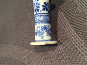 A Chinese blue and white porcelain candlestick and a miniature teapot, 18th C.