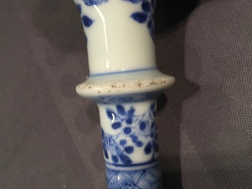 A Chinese blue and white porcelain candlestick and a miniature teapot, 18th C.