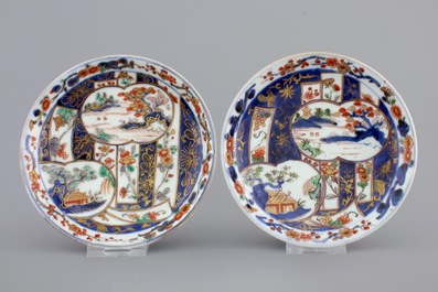 A pair of Japanese Imari porcelain cups and covers on stand, 18th C.