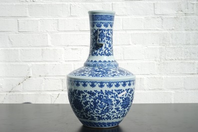 A Chinese blue and white Ming-style porcelain &quot;arrow&quot; vase with lotus scrolls, 19/20th C.