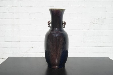 A tall Chinese porcelain flambe glaze vase with elephant handles, 19/20th C.