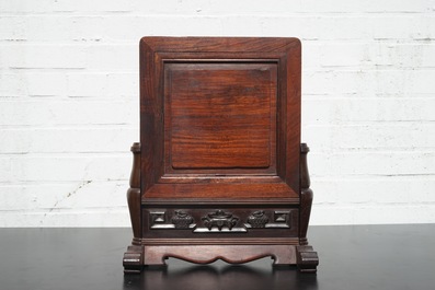 A Chinese dream stone plaque in a carved hardwood stand, 19/20th C.