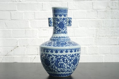 A Chinese blue and white Ming-style porcelain &quot;arrow&quot; vase with lotus scrolls, 19/20th C.