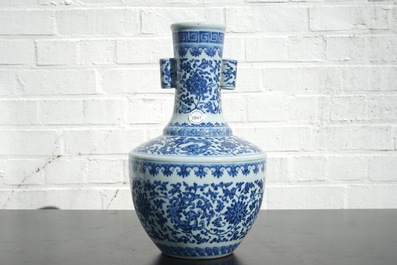 A Chinese blue and white Ming-style porcelain &quot;arrow&quot; vase with lotus scrolls, 19/20th C.