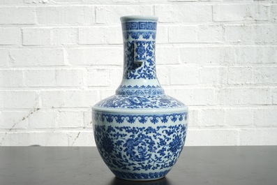 A Chinese blue and white Ming-style porcelain &quot;arrow&quot; vase with lotus scrolls, 19/20th C.
