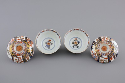 A pair of Japanese Imari porcelain cups and covers on stand, 18th C.