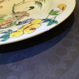 A Chinese famillle rose porcelain plate with ladies in a garden with a qin, Yongzheng, 1722-1735