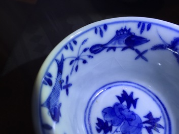 A set of six Chinese blue and white cups and saucers with fish, 19th C.