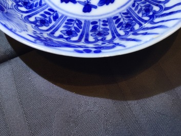 A set of six Chinese blue and white cups and saucers with fish, 19th C.