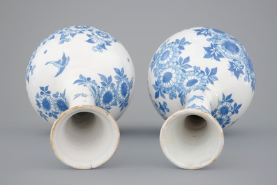 A pair of Dutch Delft blue and white bottle-shaped vases, 17th C.