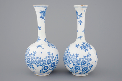 A pair of Dutch Delft blue and white bottle-shaped vases, 17th C.