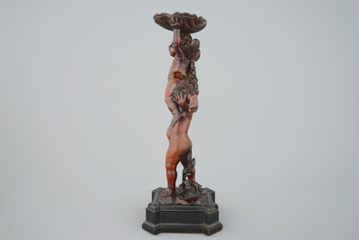 A carved boxwood vase stand with putti, Venice,late 17th C., circle of Andrea Brustolon