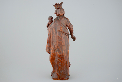 A tall boxwood sculpture of Madonna and Child, 17th C.