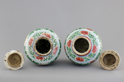 A pair of Chinese wucai porcelain vases with covers, Transitional period, 1620-1683