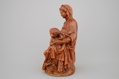 A boxwood sculpture of a seated Madonna with child, 17th C.