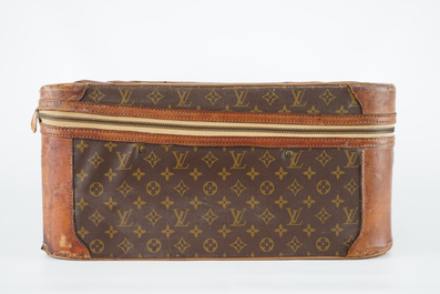 A Louis Vuitton leather travel suitcase, mid 20th C.
