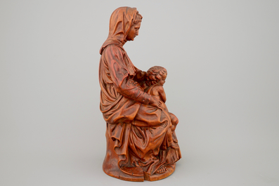 A boxwood sculpture of a seated Madonna with child, 17th C.
