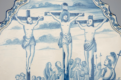 A large Dutch Delft blue and white Crucifixion plaque, Rotterdam, 18th C.