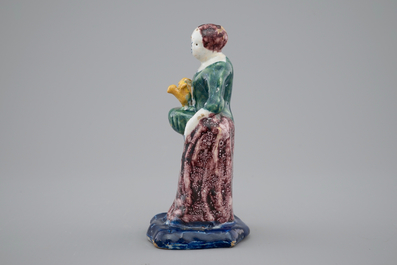 A Dutch Delft polychrome figure of a lady, 18th C.