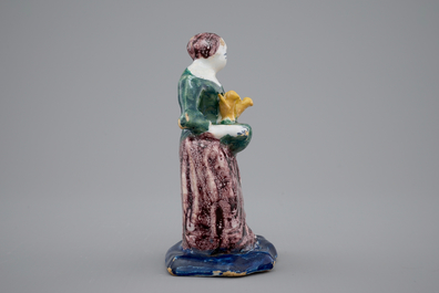 A Dutch Delft polychrome figure of a lady, 18th C.