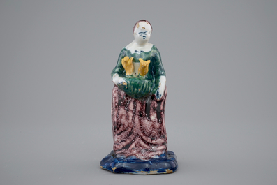 A Dutch Delft polychrome figure of a lady, 18th C.