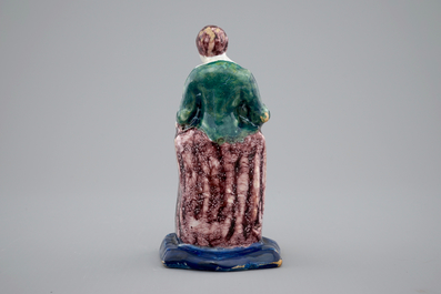 A Dutch Delft polychrome figure of a lady, 18th C.