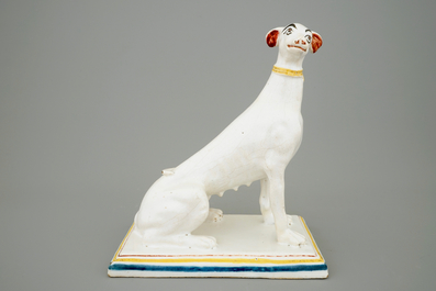 A tall polychrome Brussels faience model of a sighthound, 18th C.