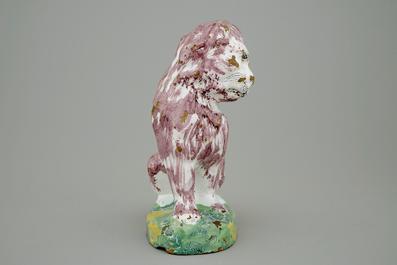 A tall polychrome Brussels faience model of a dog, 18th C.