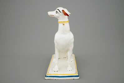 A tall polychrome Brussels faience model of a sighthound, 18th C.