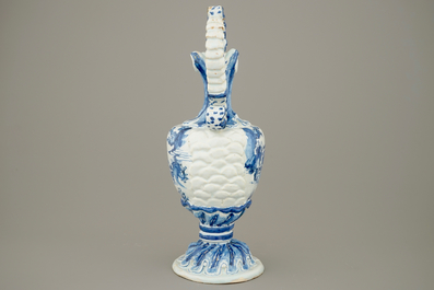 A large French faience blue and white relief-decorated jug, 18th C.
