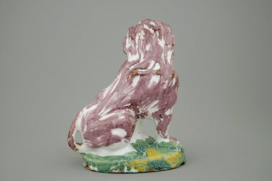 A tall polychrome Brussels faience model of a dog, 18th C.