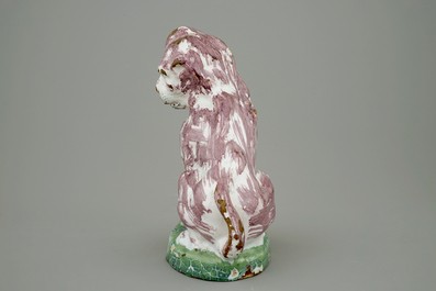 A tall polychrome Brussels faience model of a dog, 18th C.