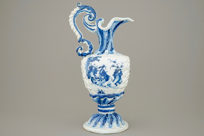 A large French faience blue and white relief-decorated jug, 18th C.