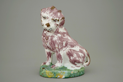 A tall polychrome Brussels faience model of a dog, 18th C.