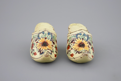A pair of Dutch Delft polychrome pottery shoes and a blue and white bowl, 18th C.