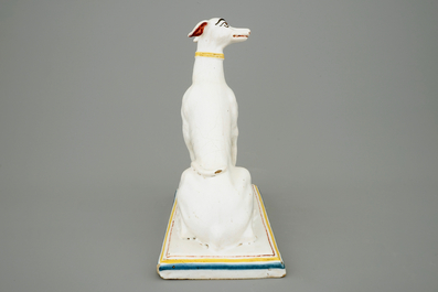 A tall polychrome Brussels faience model of a sighthound, 18th C.