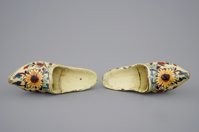 A pair of Dutch Delft polychrome pottery shoes and a blue and white bowl, 18th C.