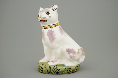 A polychrome Brussels faience model of a cat, 18th C.