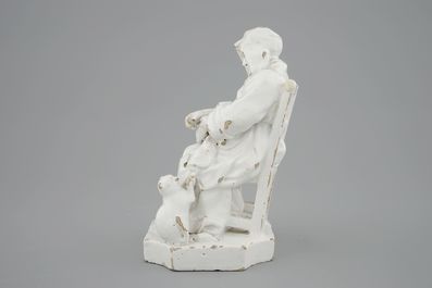 A monochrome white faience group of a seated lady, 18th C., poss. Brussels