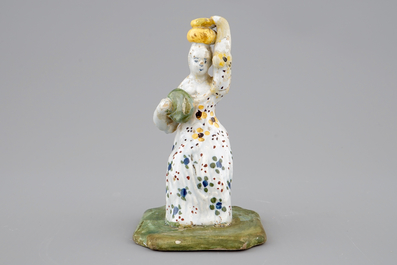 A Dutch Delft figure of a lady, 18th C.