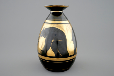 A Charles Catteau gilt on black vase with bears for Boch K&eacute;ramis, 1st half 20th C.