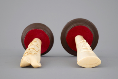 Two carved ivory umbrella or parasol handles, Dieppe (?), 19th C.