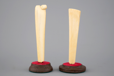 Two carved ivory umbrella or parasol handles, Dieppe (?), 19th C.