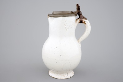A white monochrome Dutch Delft pewter-mounted jug, 17/18th C.