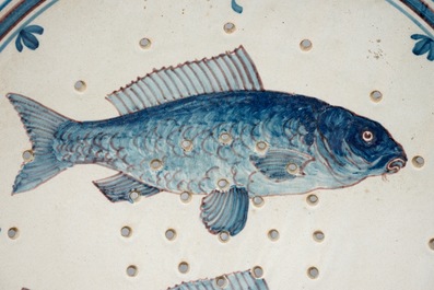 A Dutch Delft fish strainer, Makkum, Friesland, late 19th C.