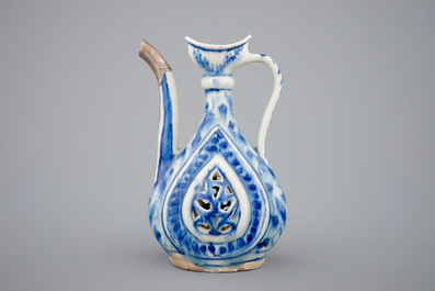 A reticulated blue and white silver-mounted Safavid jug, 17/18th C.