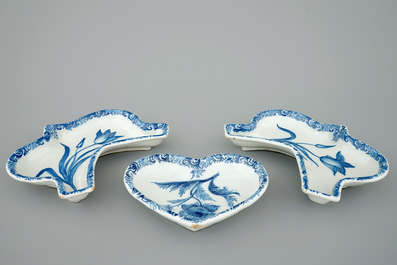 Three Dutch Delft blue and white rice table dishes with flowers, 18th C.